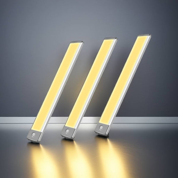 Three LED strip lights on a reflective surface with a dark background